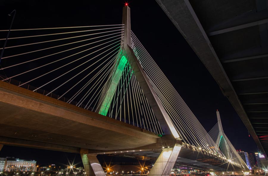 Image of a bridge with green lighting to celebrate TCF
