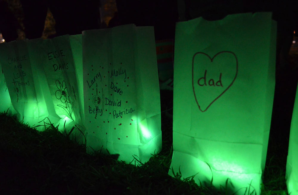 Memorial bags lit in green light for the "Target the Darkness" event