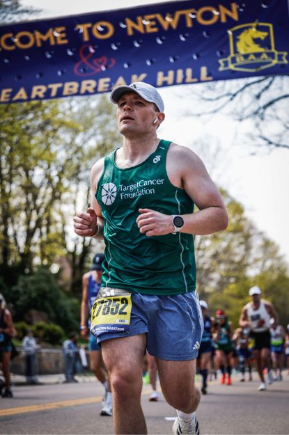Spencer Lindsay running the Boston Marathon with Team TCF